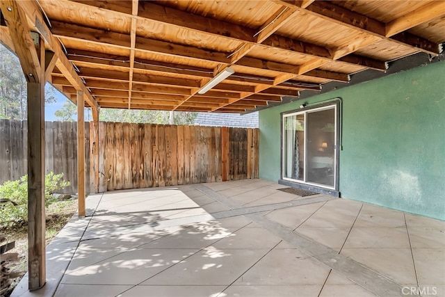 view of patio featuring fence