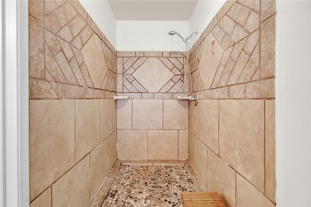 full bath with a tile shower