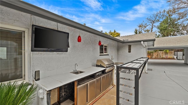 5092 Myrtle Ave, Riverside, CA 92506 - view of patio / terrace with a grill, exterior kitchen, a sink, and fence