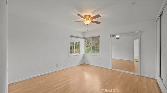 5092 Myrtle Ave, Riverside, CA 92506 - unfurnished bedroom featuring baseboards, a ceiling fan, a closet, and light wood-type flooring