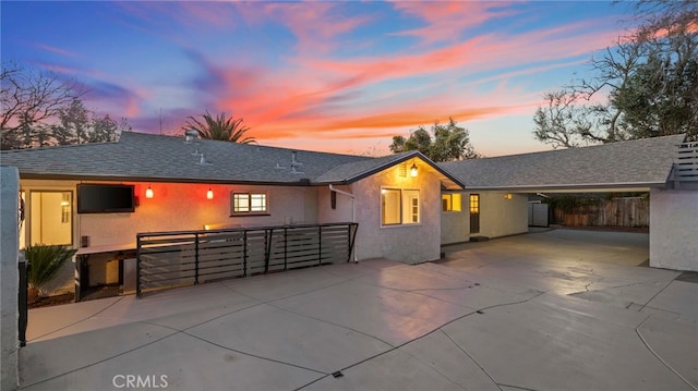 5092 Myrtle Ave, Riverside, CA 92506 - view of front facade featuring concrete driveway, stucco siding, a shingled roof, and fence