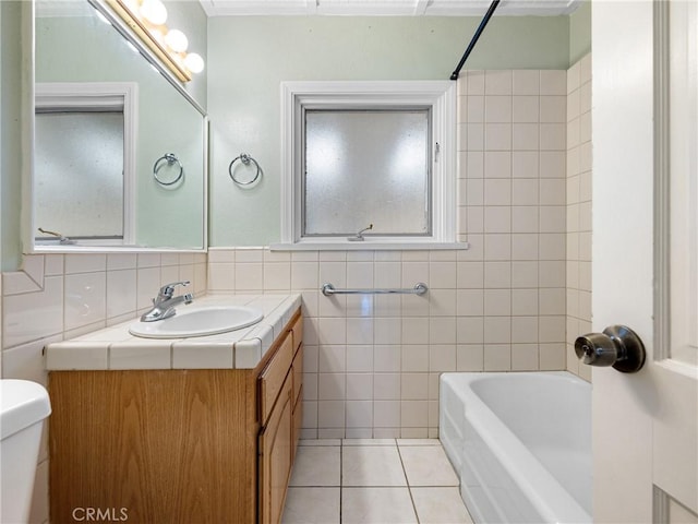449 Highland Ave, Barstow, CA 92311 - full bathroom featuring toilet, tile patterned floors, tile walls, and vanity