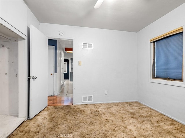 449 Highland Ave, Barstow, CA 92311 - empty room with baseboards, light carpet, a ceiling fan, and visible vents