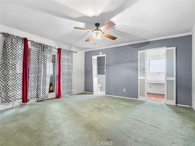 449 Highland Ave, Barstow, CA 92311 - unfurnished bedroom with crown molding, carpet, ensuite bath, and baseboards