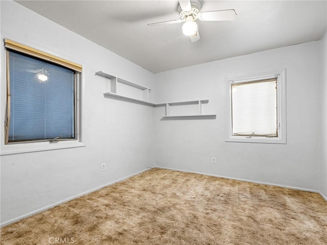 449 Highland Ave, Barstow, CA 92311 - empty room featuring ceiling fan, baseboards, and carpet