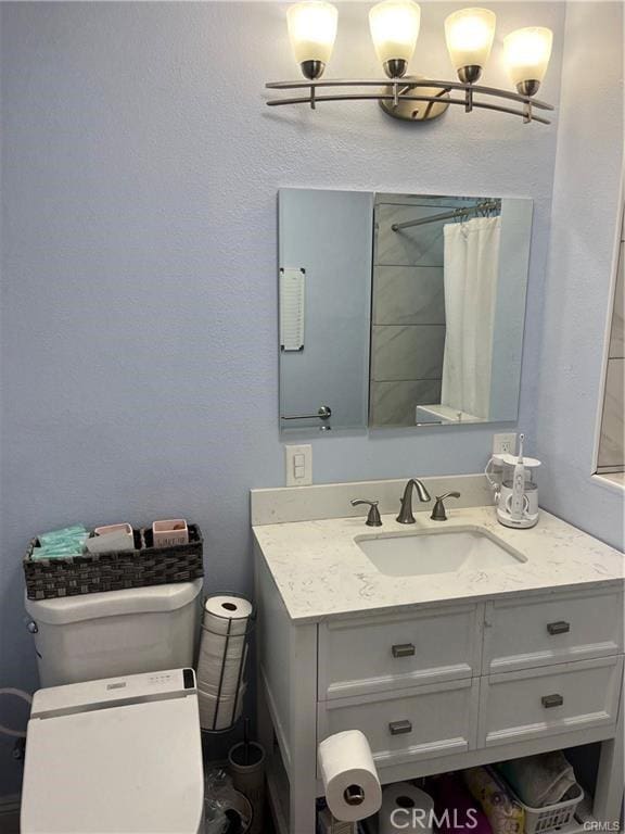 full bathroom featuring vanity and a shower with shower curtain