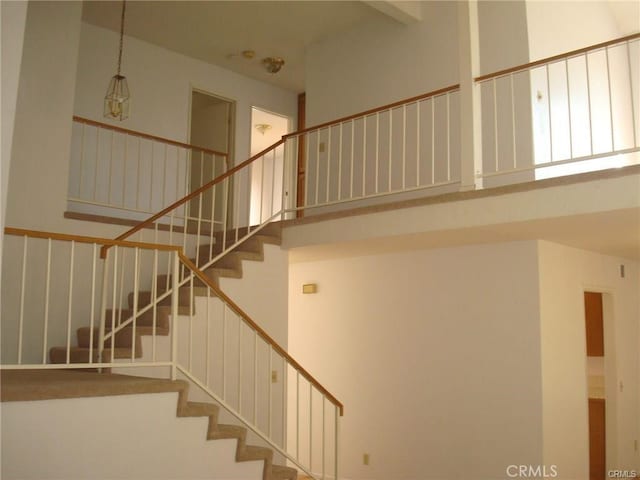 6483 N Walnut Ave, San Bernardino, CA 92407 - staircase featuring a high ceiling