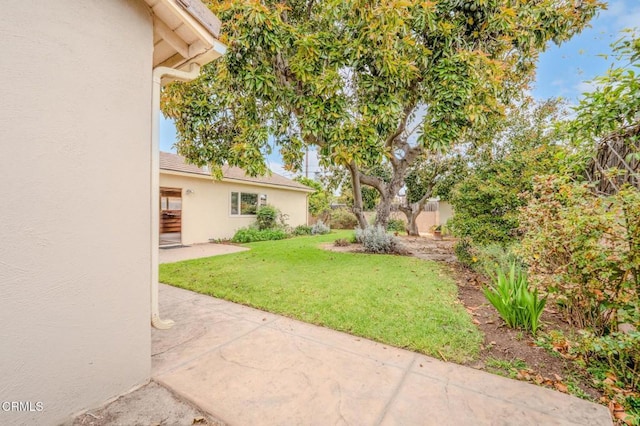view of yard with a patio area and fence