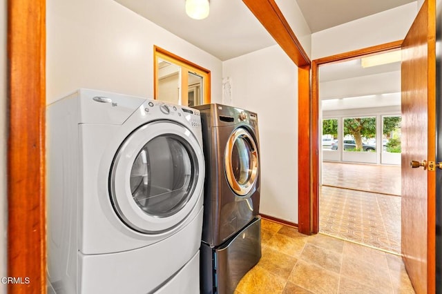 laundry room featuring separate washer and dryer and laundry area