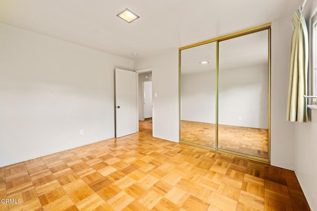 unfurnished bedroom with a closet