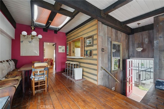 2218 Pacific Ave, Venice, CA 90291 - living area featuring wooden walls, beam ceiling, and hardwood / wood-style flooring