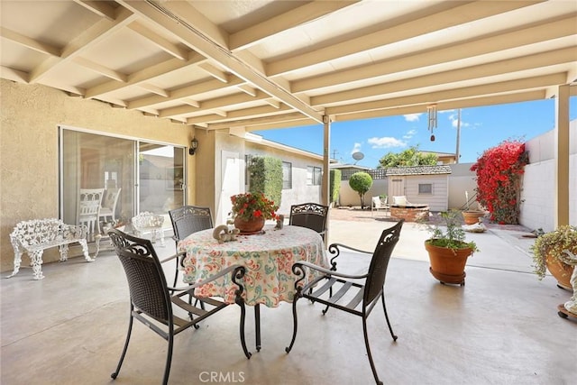 view of patio featuring outdoor dining area and a fenced backyard