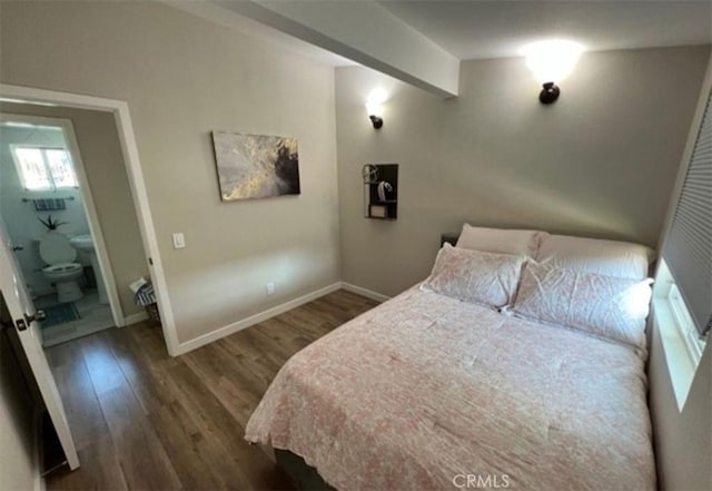 bedroom featuring dark wood-style floors and baseboards