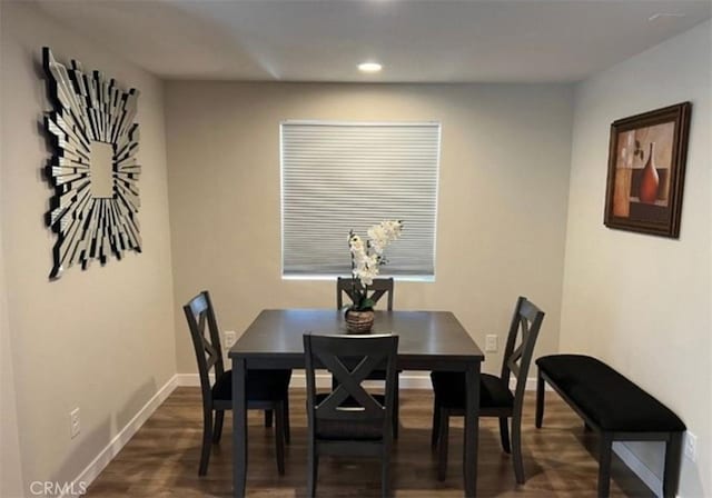 dining space with baseboards, recessed lighting, and dark wood-style floors