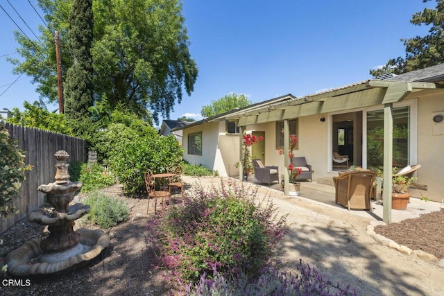 921 Topaz Ct, Ojai, CA 93023 - back of house featuring a patio, stucco siding, and fence