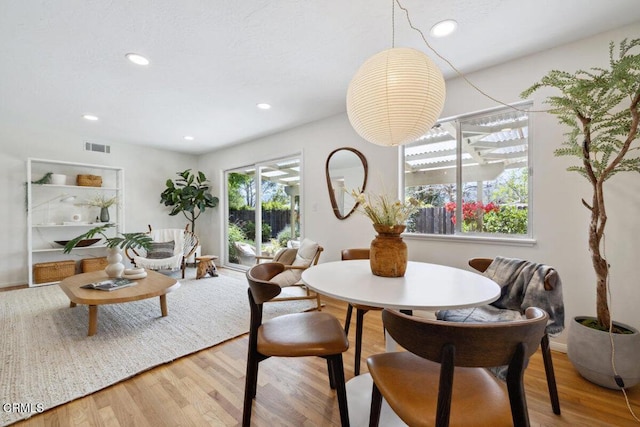921 Topaz Ct, Ojai, CA 93023 - dining room featuring recessed lighting, visible vents, and wood finished floors