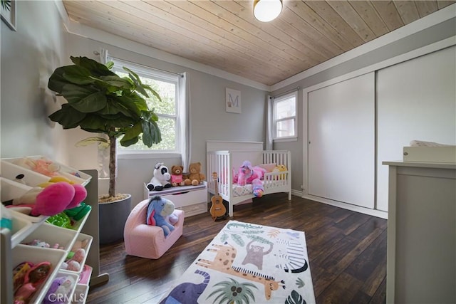 bedroom with wooden ceiling, multiple windows, and wood-type flooring