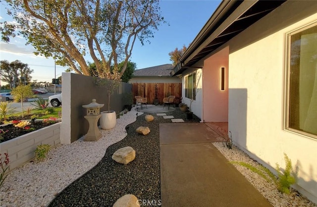 1427 N Cannon St, Orange, CA 92869 - view of home's exterior featuring fence, stucco siding, and a patio area