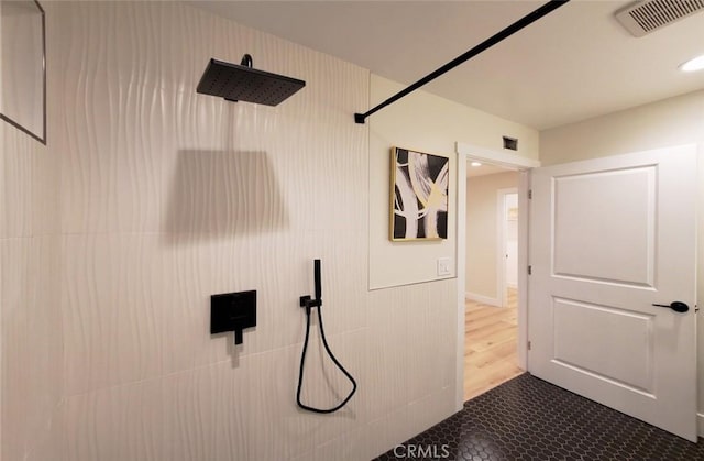 1427 N Cannon St, Orange, CA 92869 - bathroom with visible vents, tile patterned flooring, and tiled shower