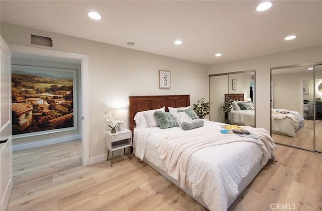 1427 N Cannon St, Orange, CA 92869 - bedroom with light wood-style floors, multiple closets, baseboards, and recessed lighting