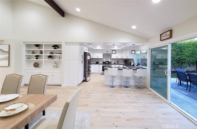 1427 N Cannon St, Orange, CA 92869 - dining area featuring recessed lighting, high vaulted ceiling, plenty of natural light, and light wood finished floors