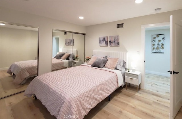 1427 N Cannon St, Orange, CA 92869 - bedroom featuring two closets, recessed lighting, baseboards, and light wood finished floors