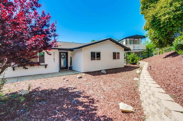 view of front of house featuring stucco siding