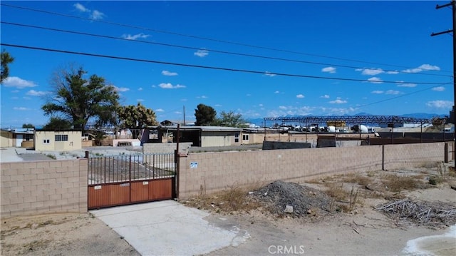 view of yard featuring a gate and a fenced front yard