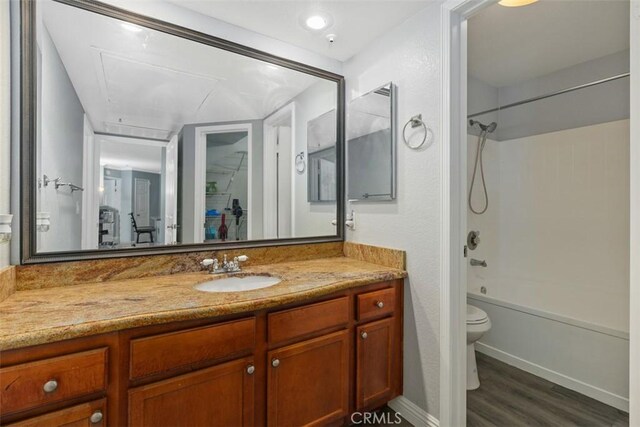 1980 Las Colinas Cir Unit 208, Corona, CA 92879 - full bathroom featuring wood finished floors, toilet, vanity, shower / washtub combination, and baseboards