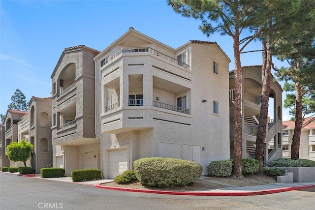 1980 Las Colinas Cir Unit 208, Corona, CA 92879 - view of building exterior featuring an attached garage