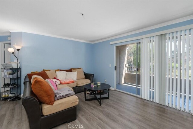 1980 Las Colinas Cir Unit 208, Corona, CA 92879 - living room with wood finished floors, ornamental molding, and baseboards