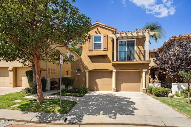 view of front of home with a tiled roof, driveway, a garage, a balcony, and stucco siding