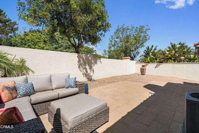 view of patio / terrace featuring a fenced backyard, an outdoor hangout area, and cooling unit