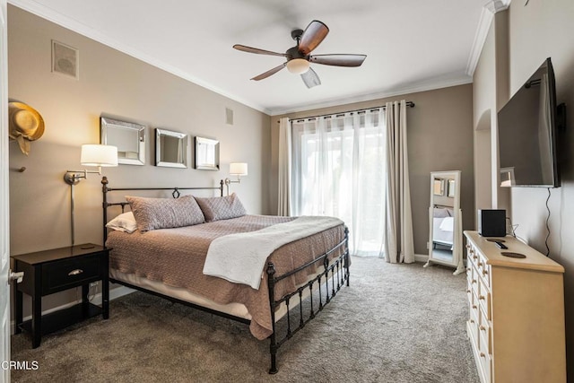 carpeted bedroom with crown molding, a ceiling fan, and visible vents