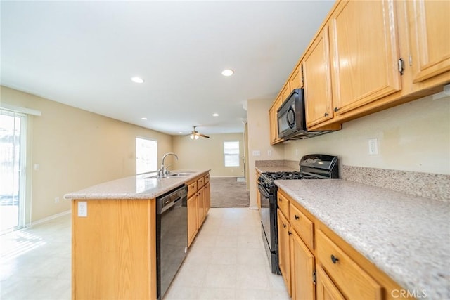 32057 Meadow Wood Ln, Lake Elsinore, CA 92532 - kitchen featuring black appliances, a sink, a kitchen island with sink, baseboards, and recessed lighting