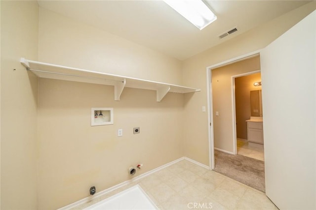32057 Meadow Wood Ln, Lake Elsinore, CA 92532 - laundry area with washer hookup, hookup for an electric dryer, hookup for a gas dryer, baseboards, and light colored carpet