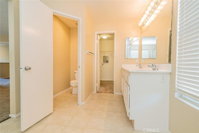 32057 Meadow Wood Ln, Lake Elsinore, CA 92532 - bathroom featuring toilet, vanity, tile patterned floors, and baseboards