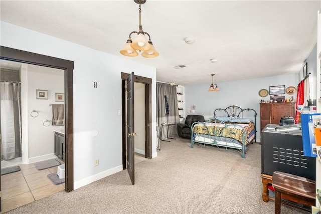 bedroom with baseboards, visible vents, light colored carpet, and a chandelier