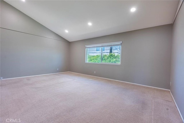 carpeted empty room with recessed lighting, baseboards, and vaulted ceiling
