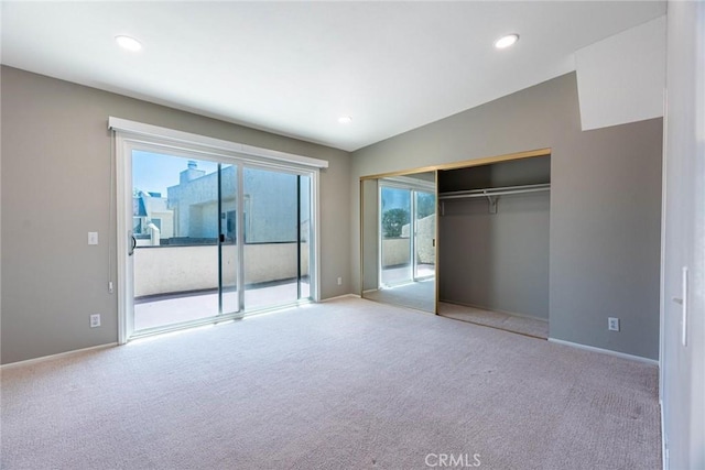 unfurnished bedroom with access to exterior and carpet