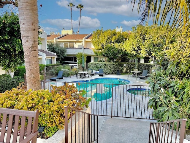 pool featuring a patio and fence