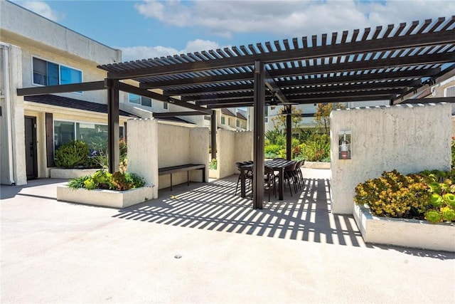 view of patio / terrace featuring a pergola and outdoor dining space