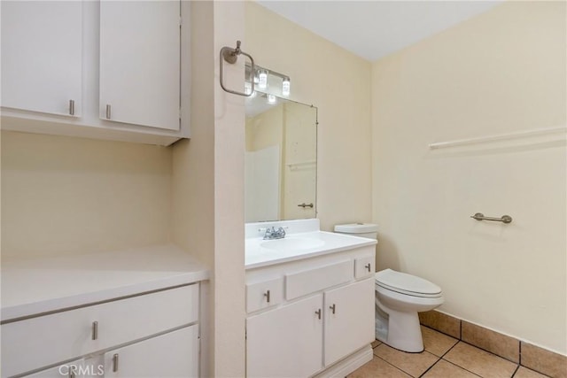 bathroom with vanity, tile patterned floors, and toilet