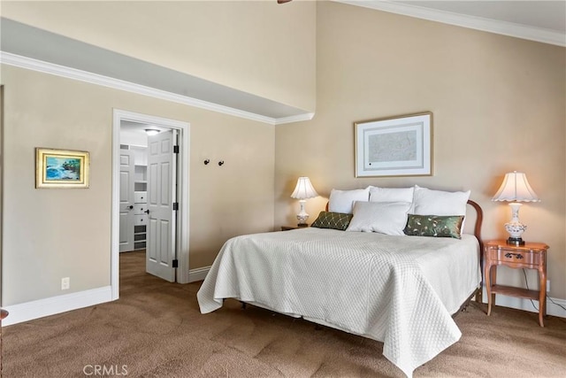 bedroom with carpet floors, ornamental molding, and baseboards