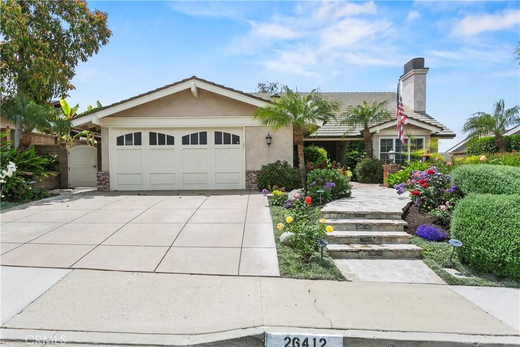 26412 Via Del Sol Msn, Viejo, CA 92691 - ranch-style house featuring a garage, stucco siding, a chimney, a gate, and driveway