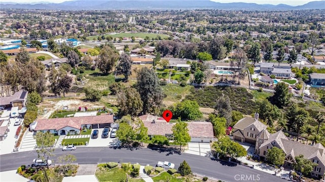 aerial perspective of suburban area featuring a mountain backdrop