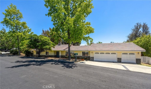40880 Via, Los Altos, Temecula, CA 92591 - single story home featuring stone siding, an attached garage, and concrete driveway