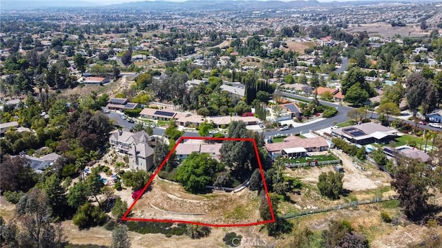 aerial view of property's location featuring property boundaries highlighted and a mountain backdrop