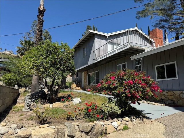 view of home's exterior featuring a balcony