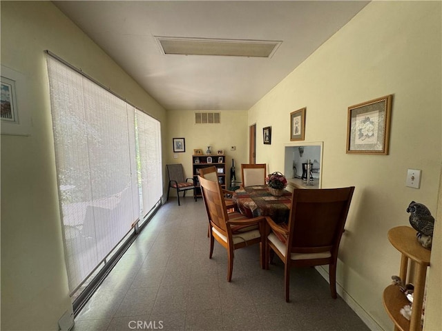 dining space featuring tile patterned floors and visible vents